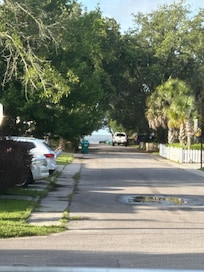 Beach can be seen from the lanai while drinking your morning coffee