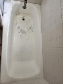 Filthy bathtub. Grungy to the touch.