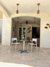 Outside pool area with beach supplies and kitchen with honor bar and snacks