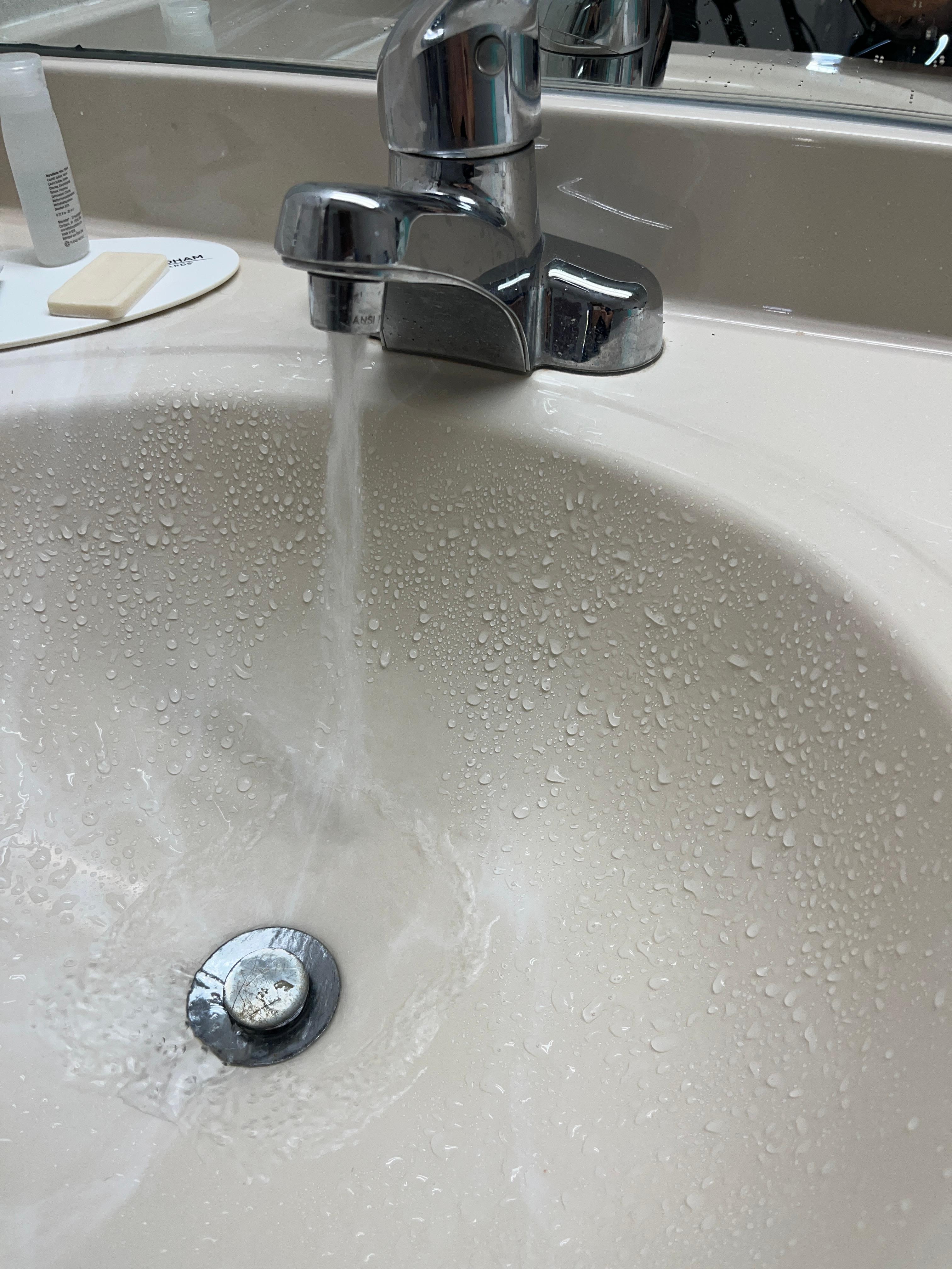 Screen on sink faucet plugged so water sprayed out