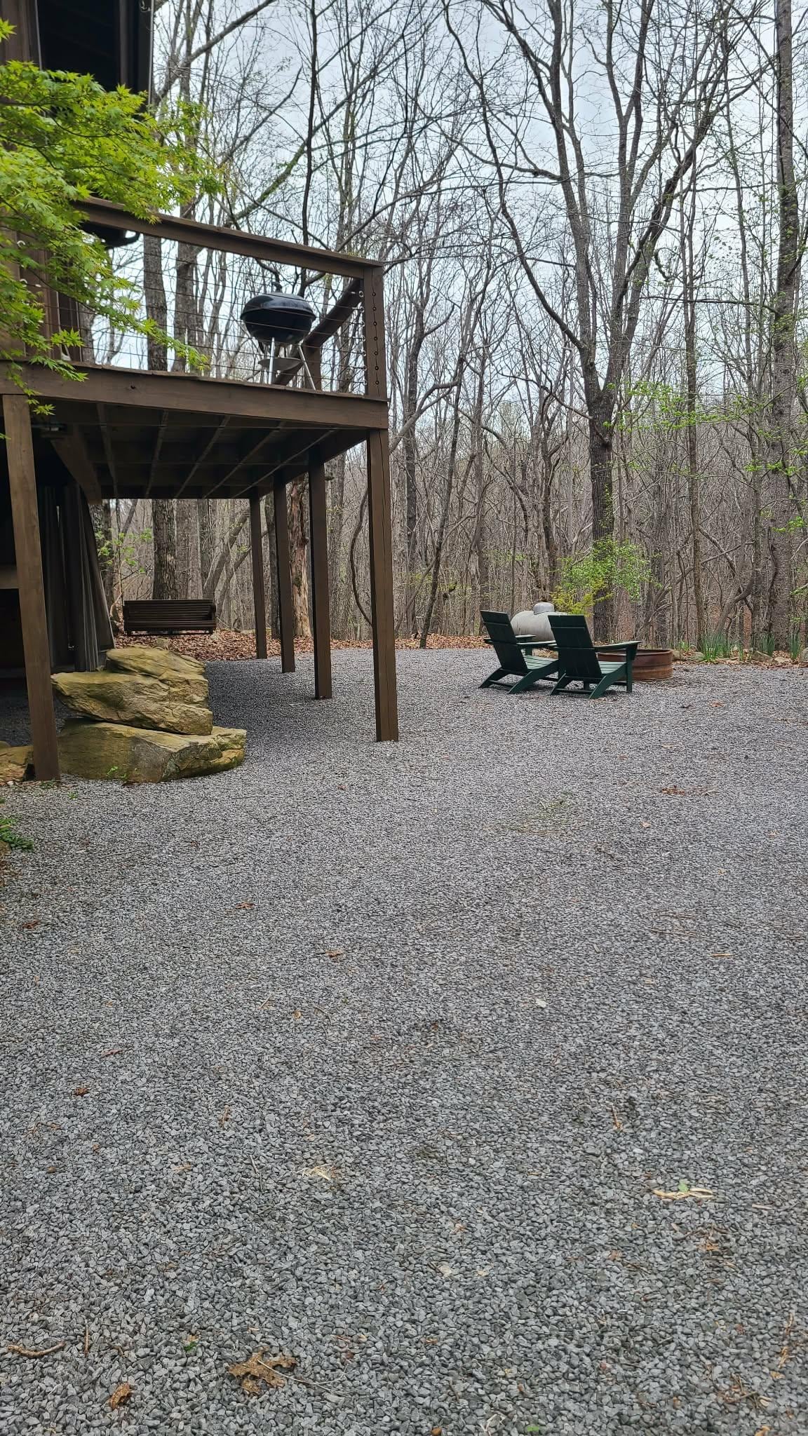 Outside the cabin, view of the firepit.