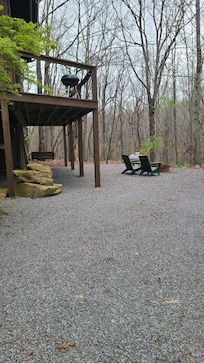 Outside the cabin, view of the firepit.