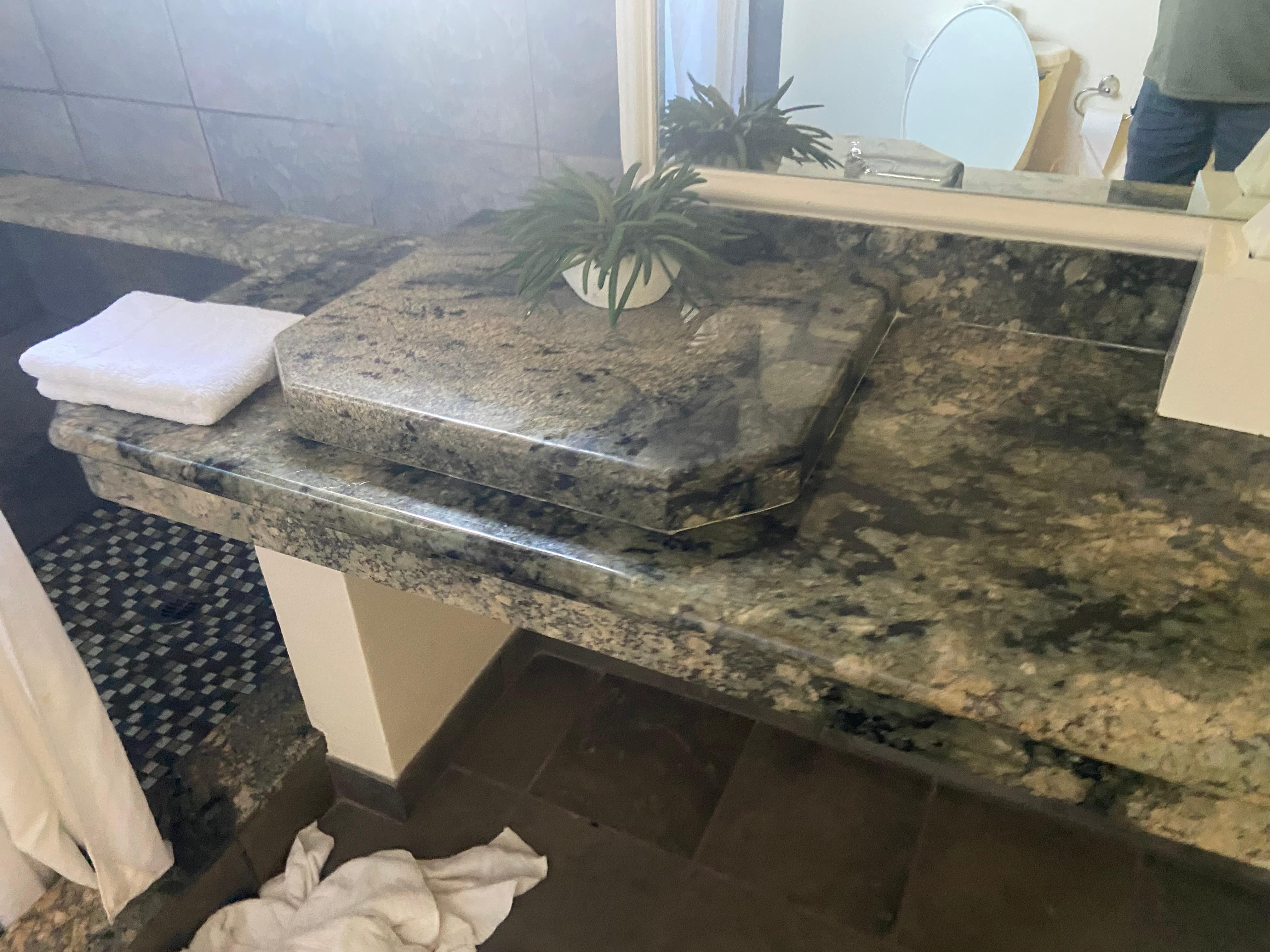 The covered over left hand nonexistent sink. Very strangely covered too! Took me a while to figure out why that big thing was on the countertop lol!