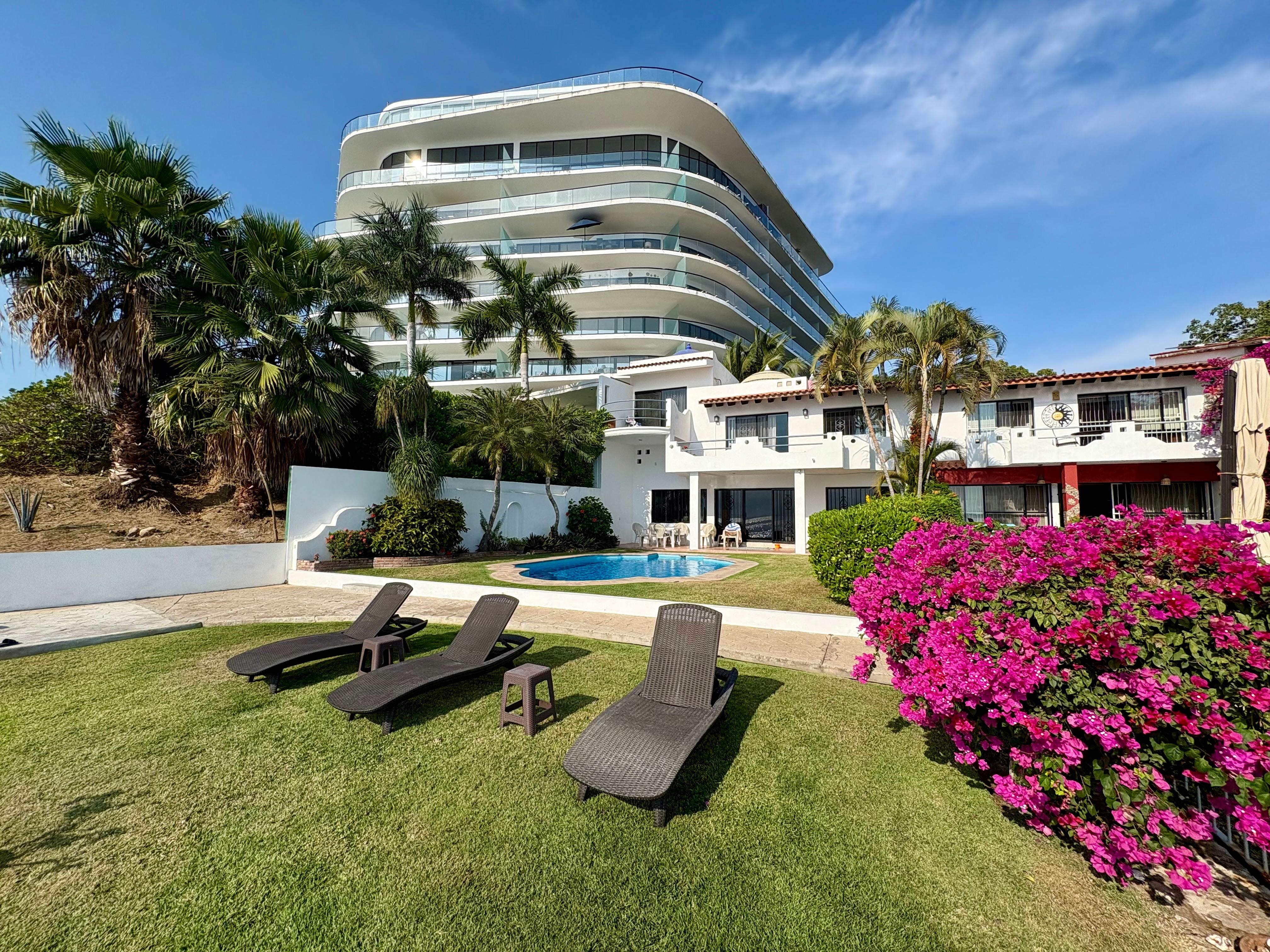 View of backyard from the edge of the property where it meets the beach 