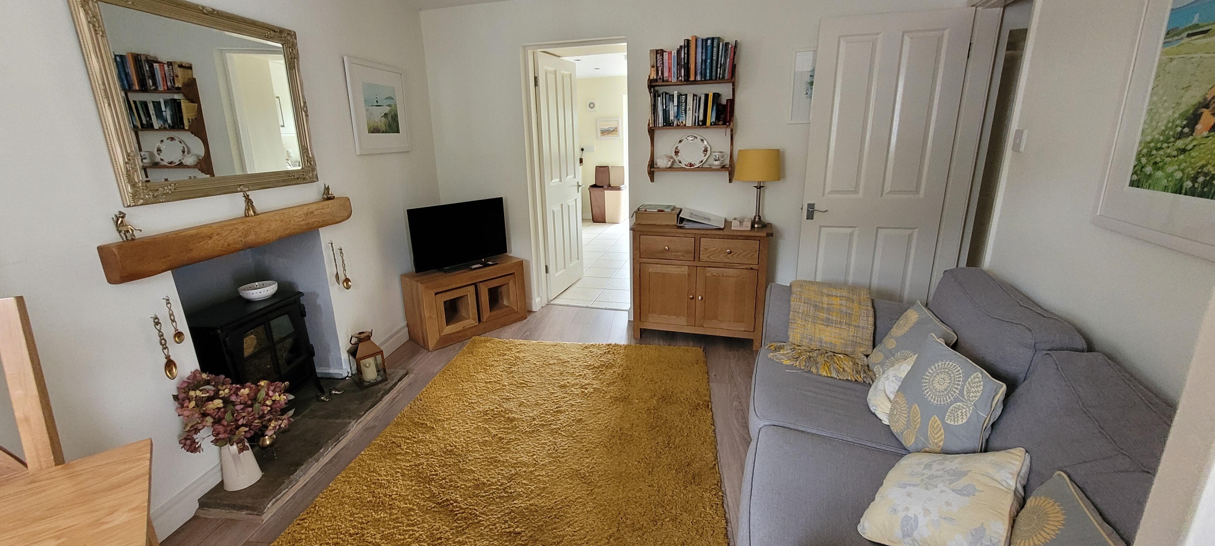 Slightly dark due to the very small cottage window but 2 extra lamps are provided. 