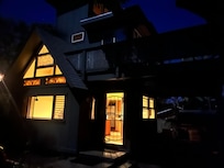 The homey house at night.