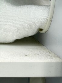 This is the shelf that clean towels were displayed for showers.