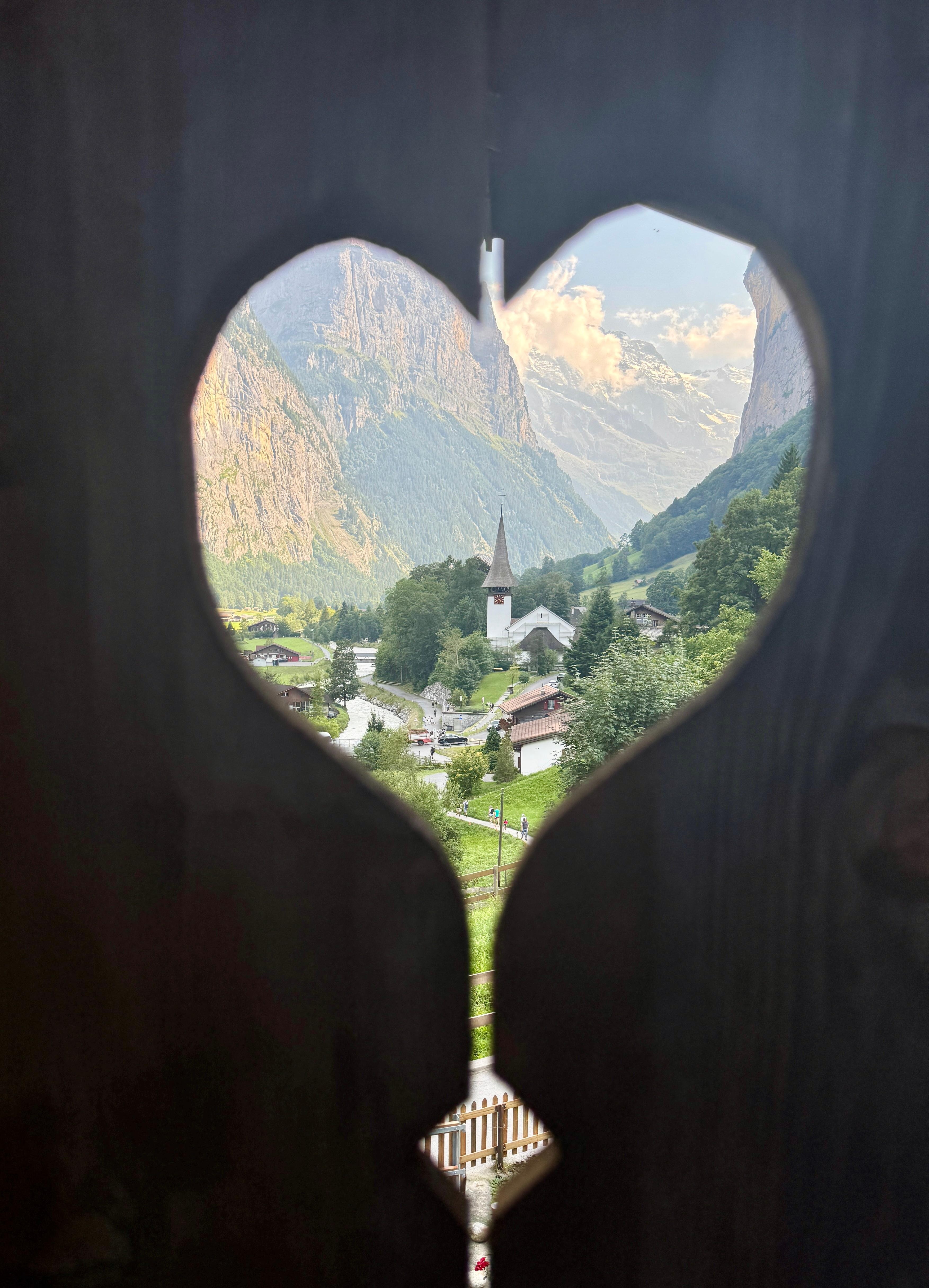 The church through  a heart shaped opening off the terrace. 