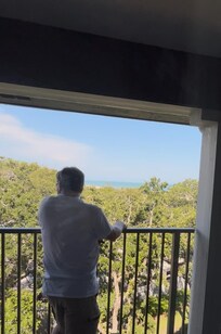 My husband, taking in the view from the balcony.