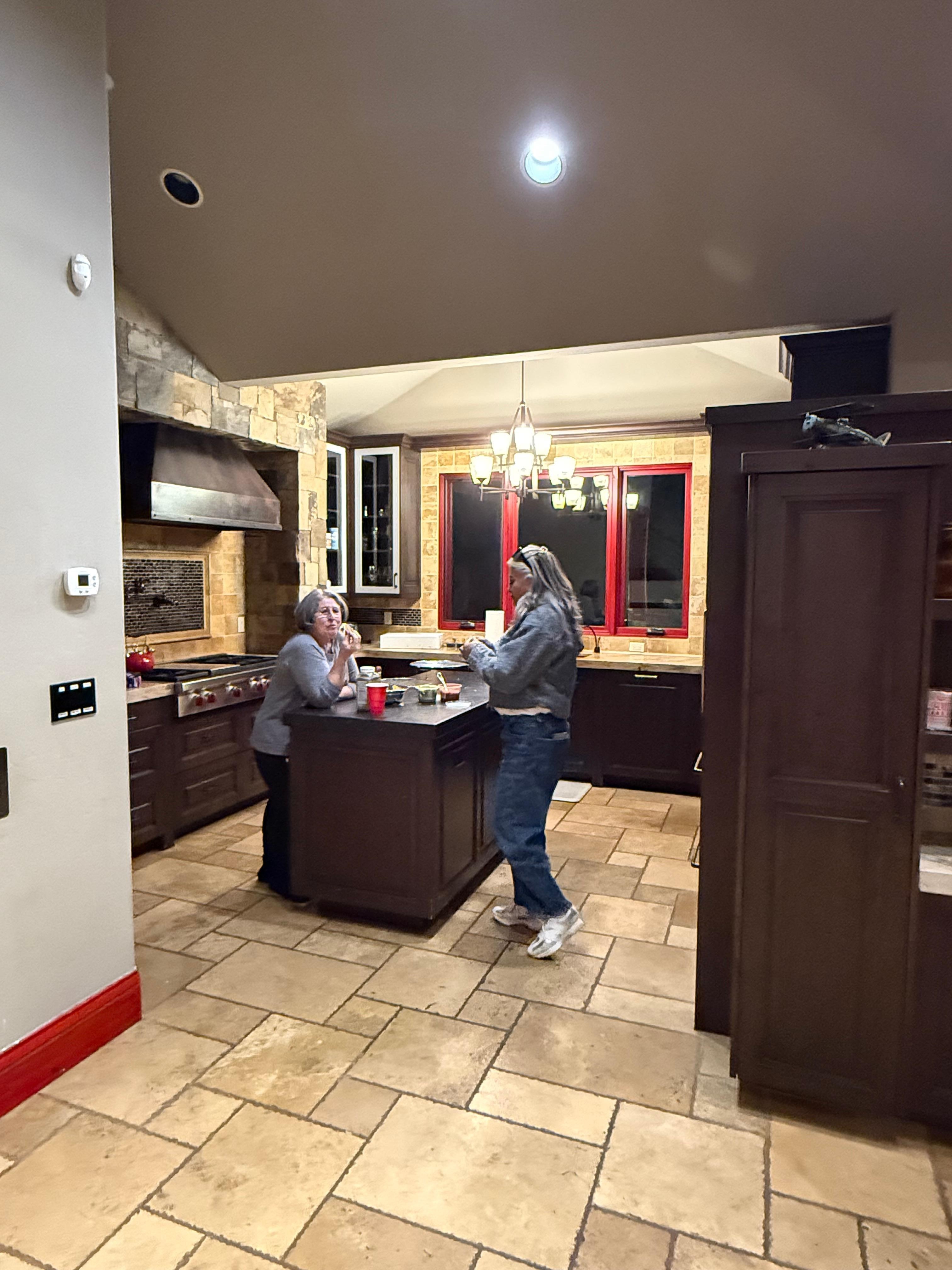 Mother in law and sister in law checking out the kitchen