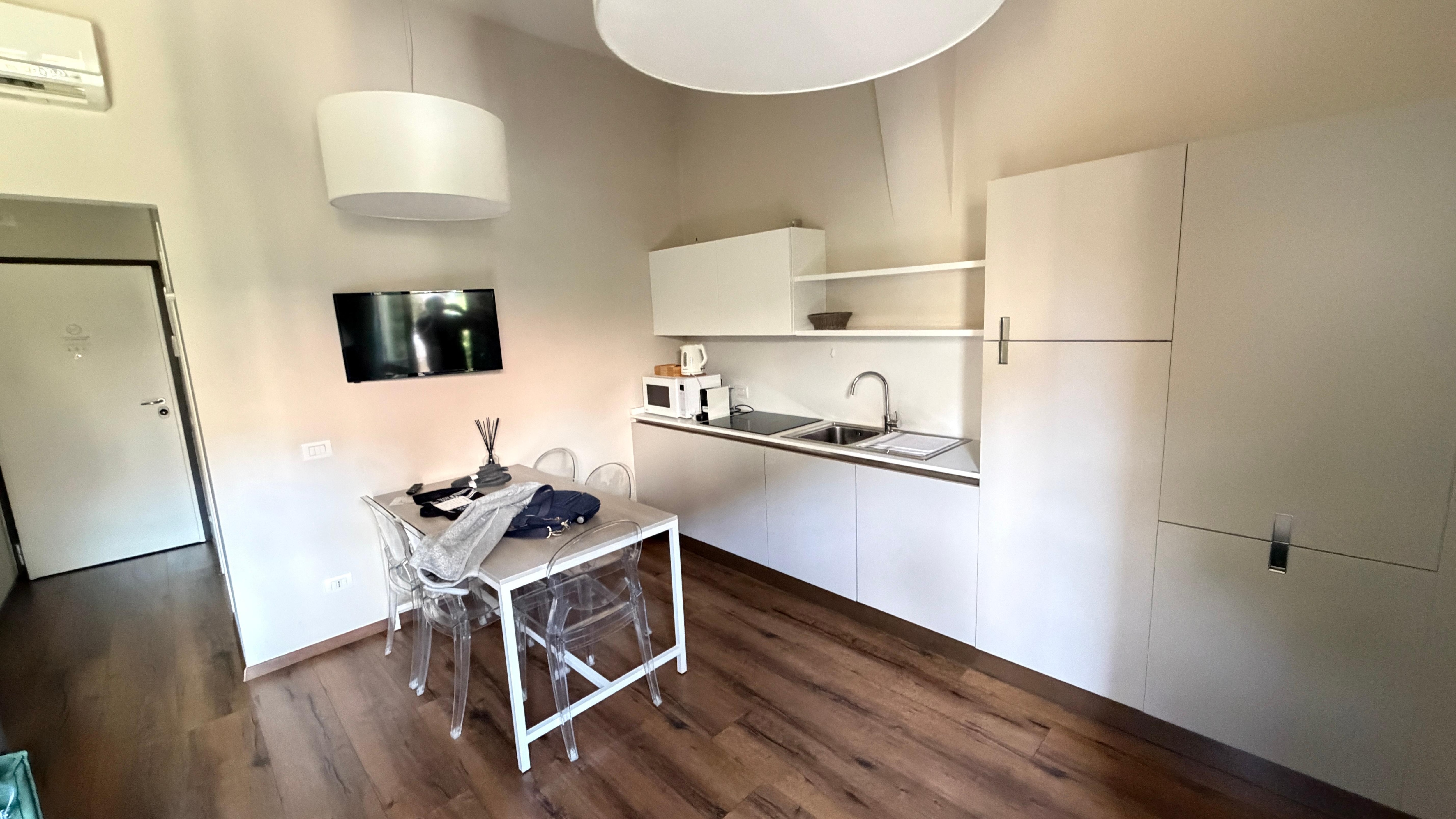 Eating area and kitchen and hallway to the front door