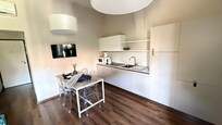 Eating area and kitchen and hallway to the front door