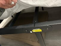 Base of bed. Mattress thin, no box spring. Aching backs were the result.