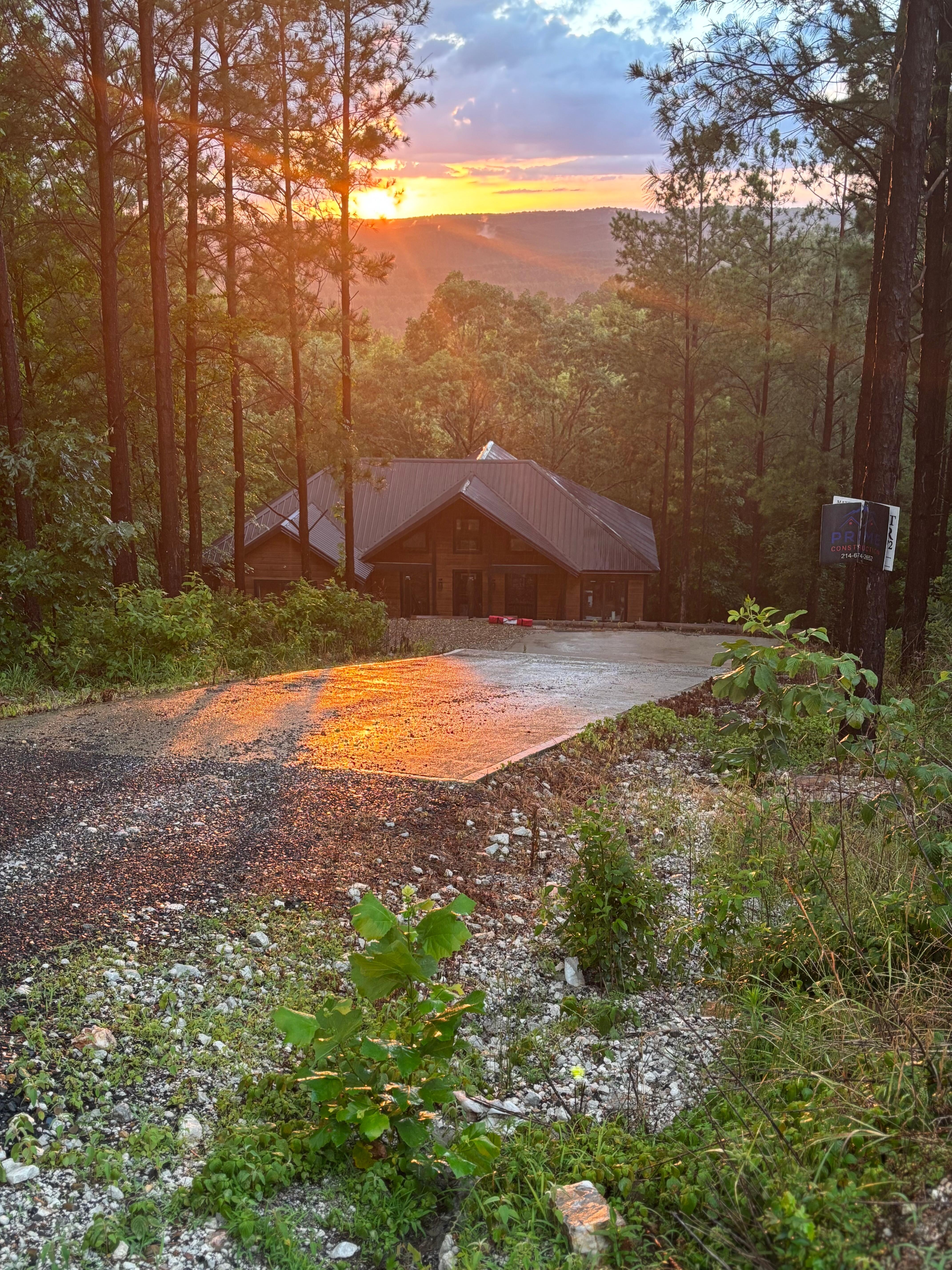Sun setting on the mountains behind the house after it rained.