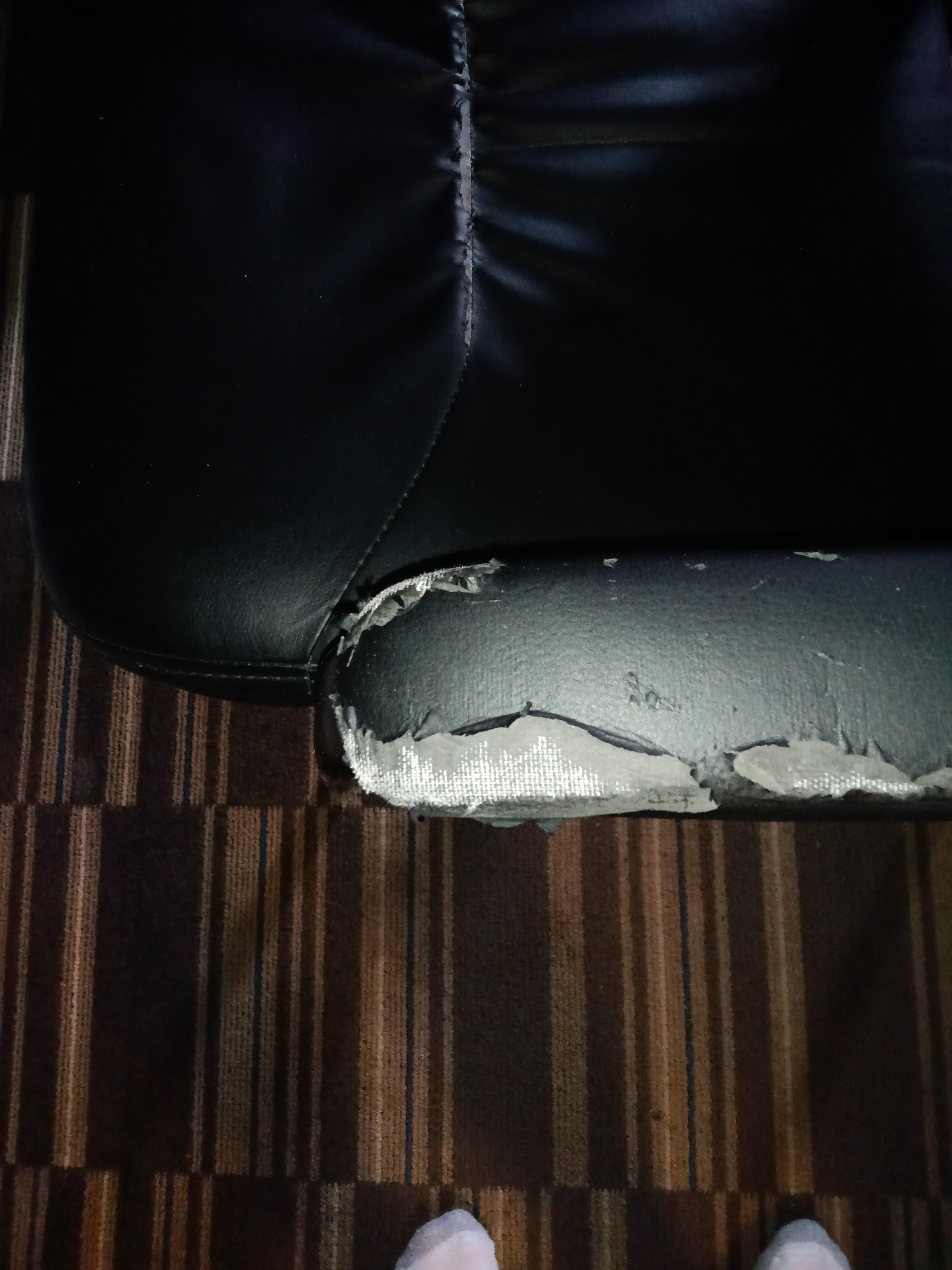 the chair which was shoved under the desk I guess gets this damage on the arms because the desk actually hangs at a downward angle and a pen placed on the desk rolls off and falls onto the floor