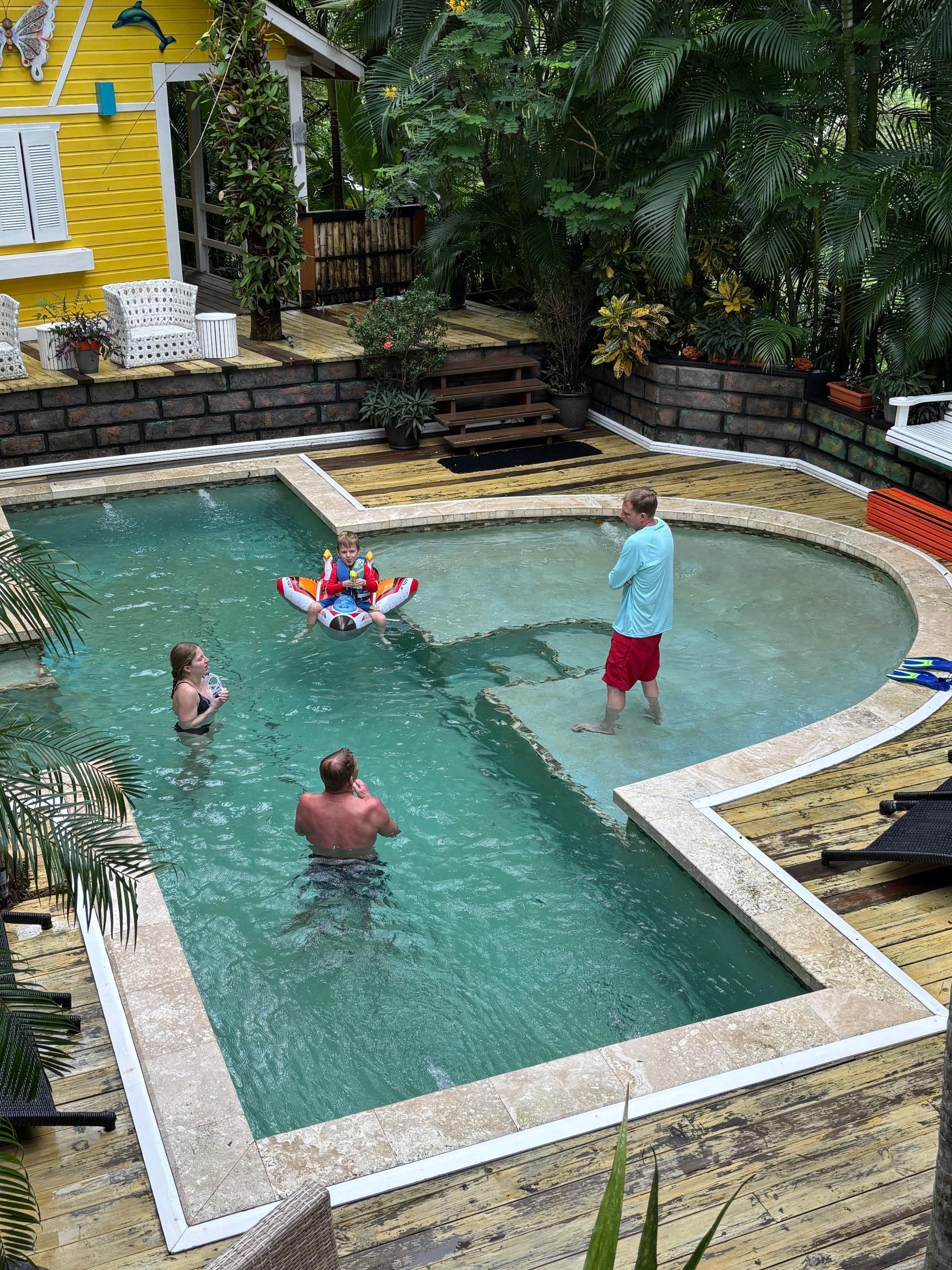 Our 4-year-old grandson shooting his cousins from his squirt-gun boat.