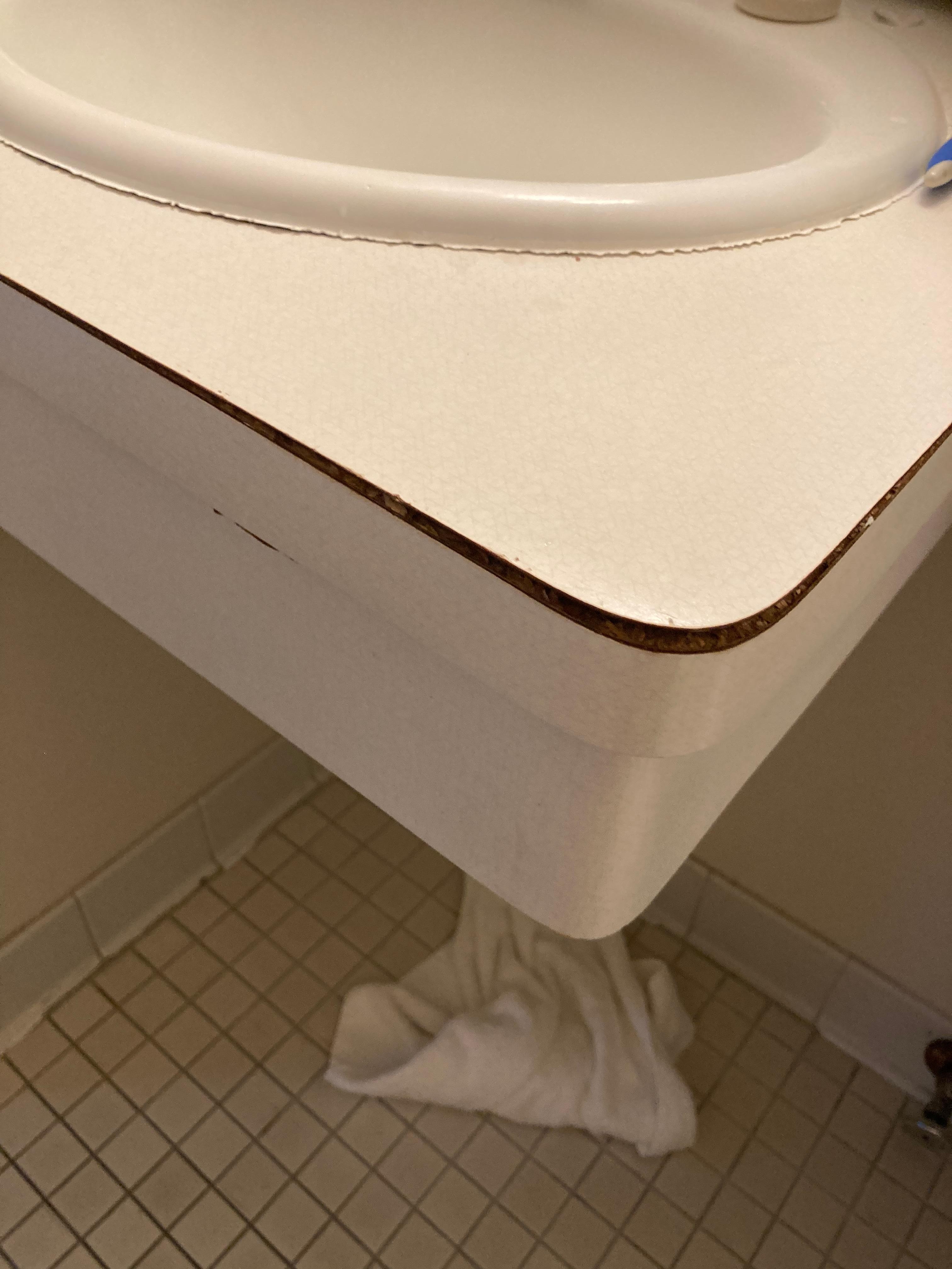 Delaminated sink top. 