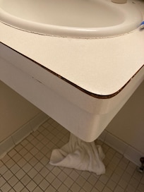 Delaminated sink top.
