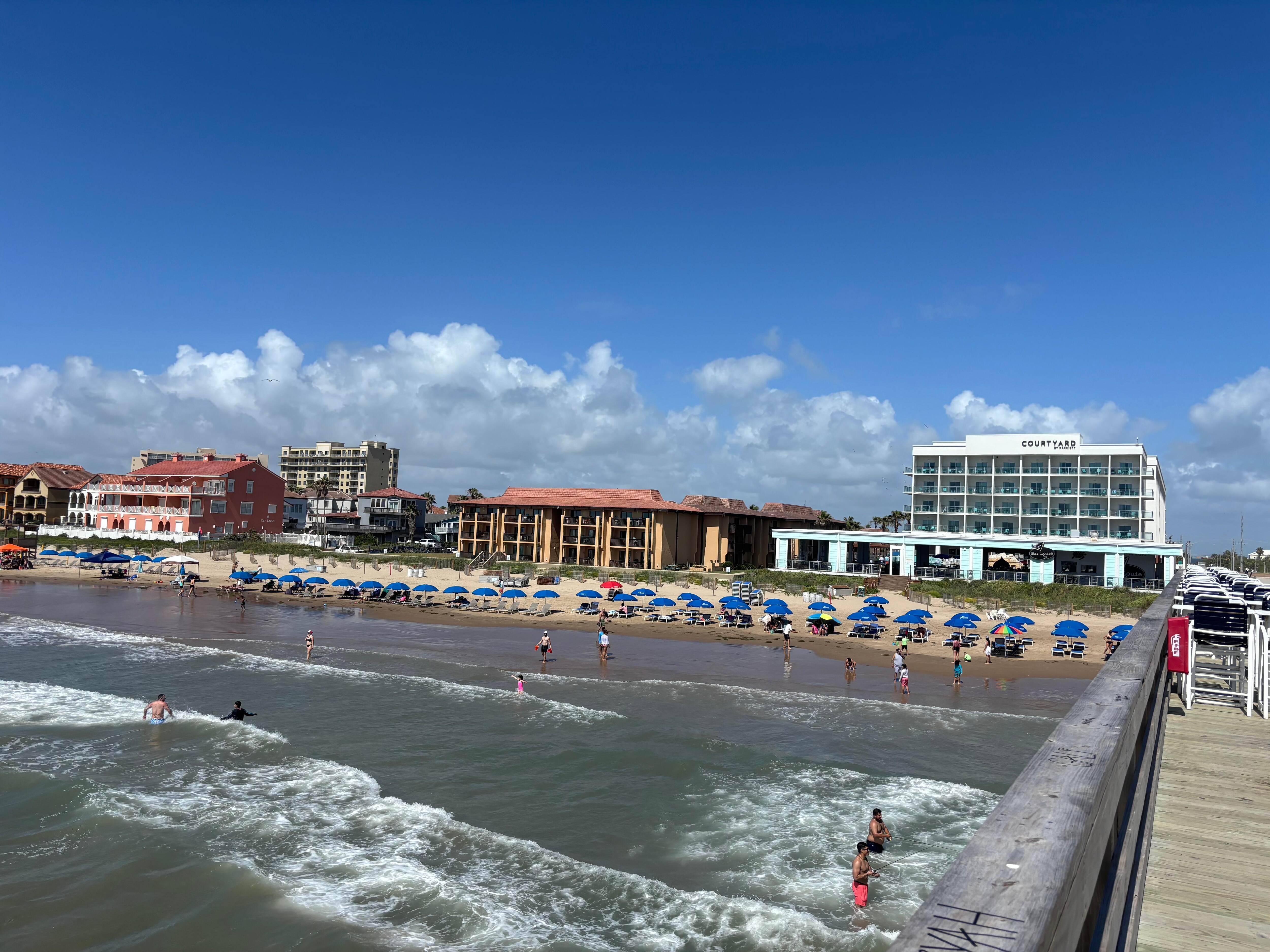 Tiki condos- center of photo.  This pic taken from Clayton’s Beach Pier-right next to door.  