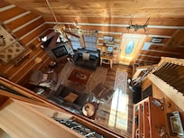 Living room from the game room/loft