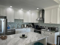 Spacious and fully stocked kitchen.