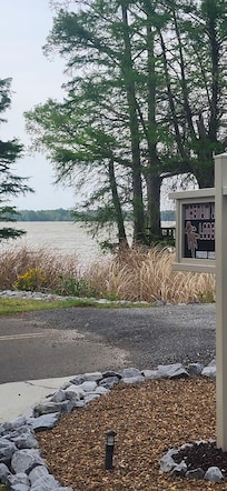 View from driveway to the lake that is across the street.