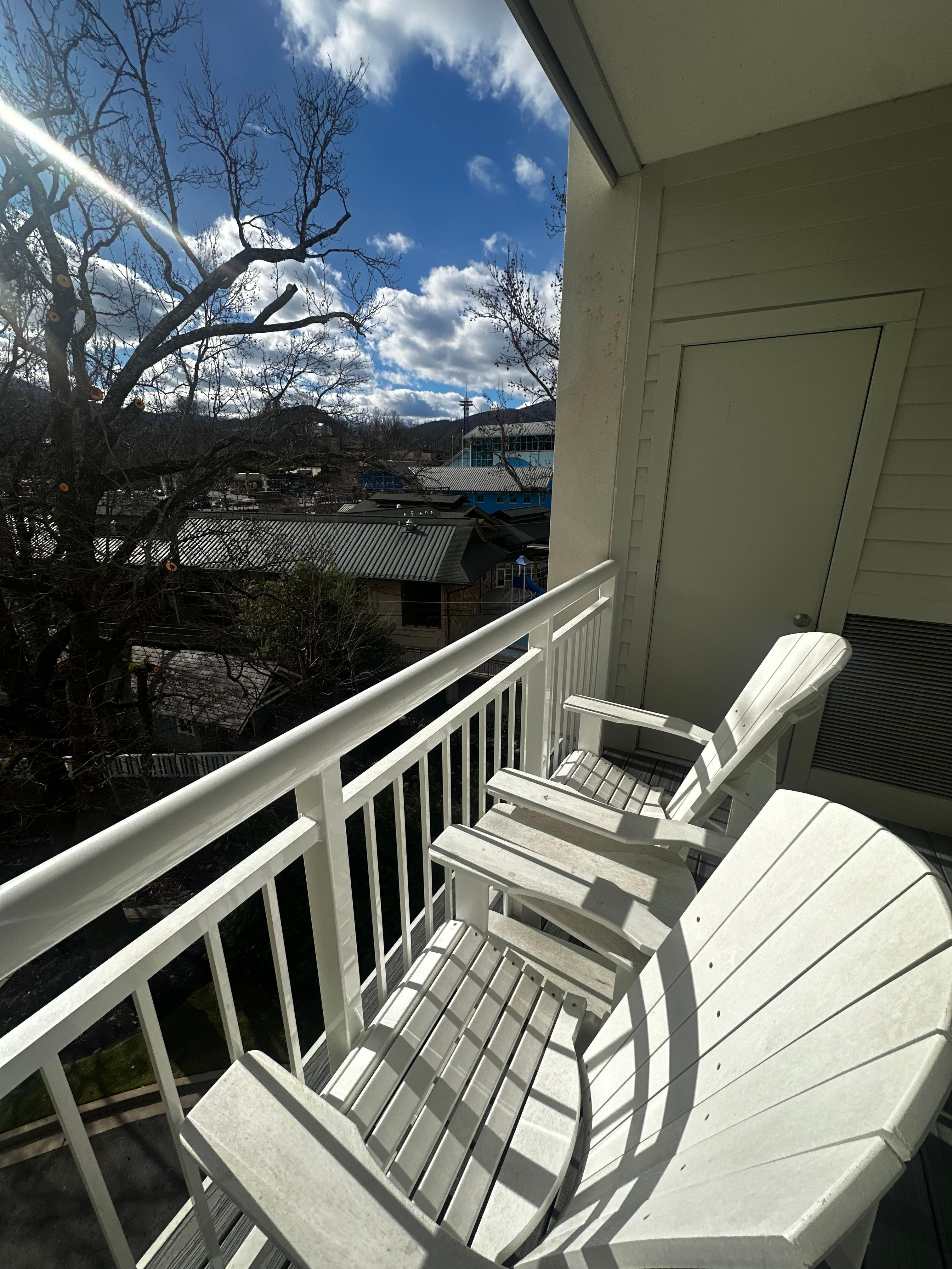 2 chairs and small table for sitting and people watching!