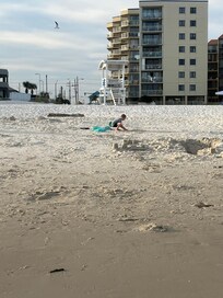 At the beach looking back, the yellow building is where we stayed to give reference. Within walking distance!