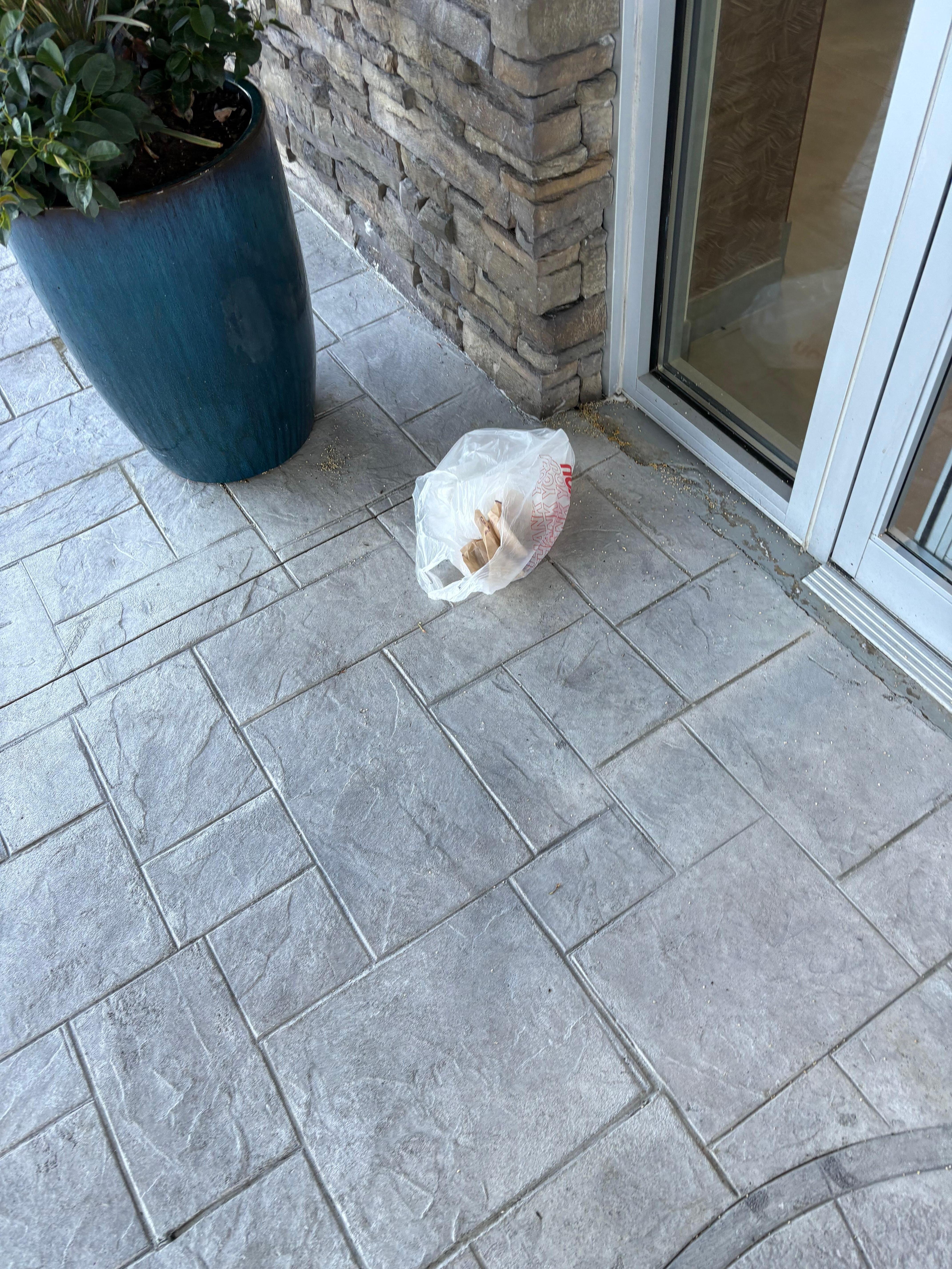 Trash at front entrance 
