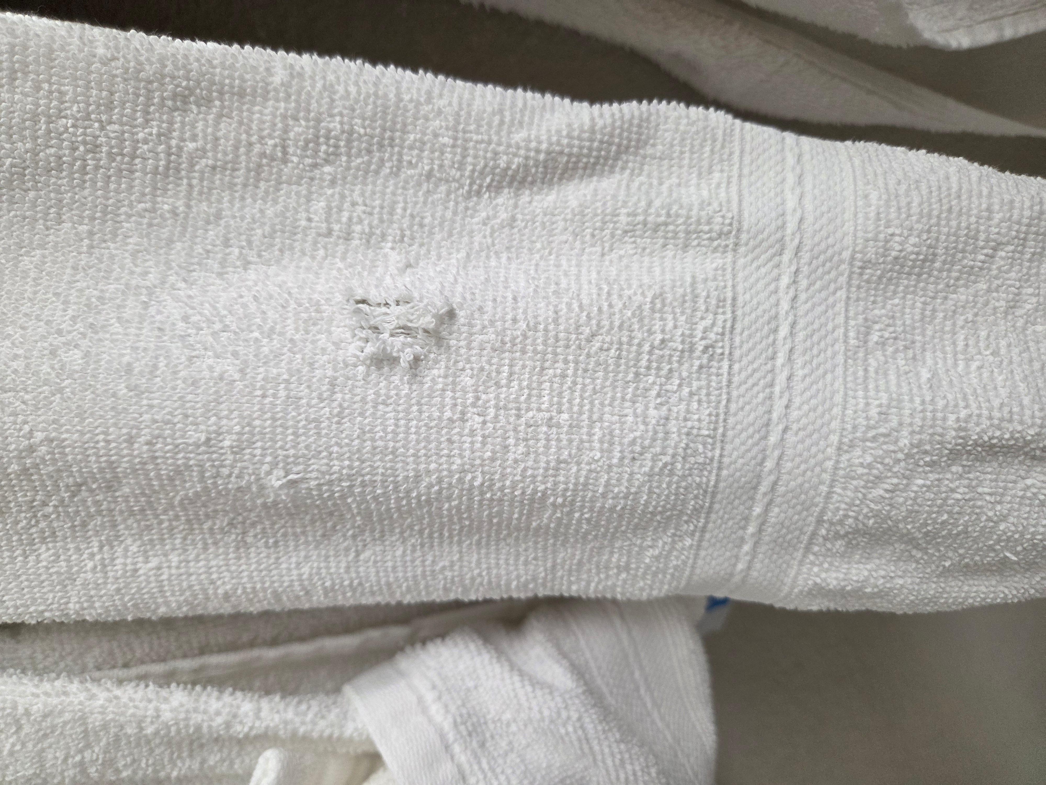 Hole in hand towel.