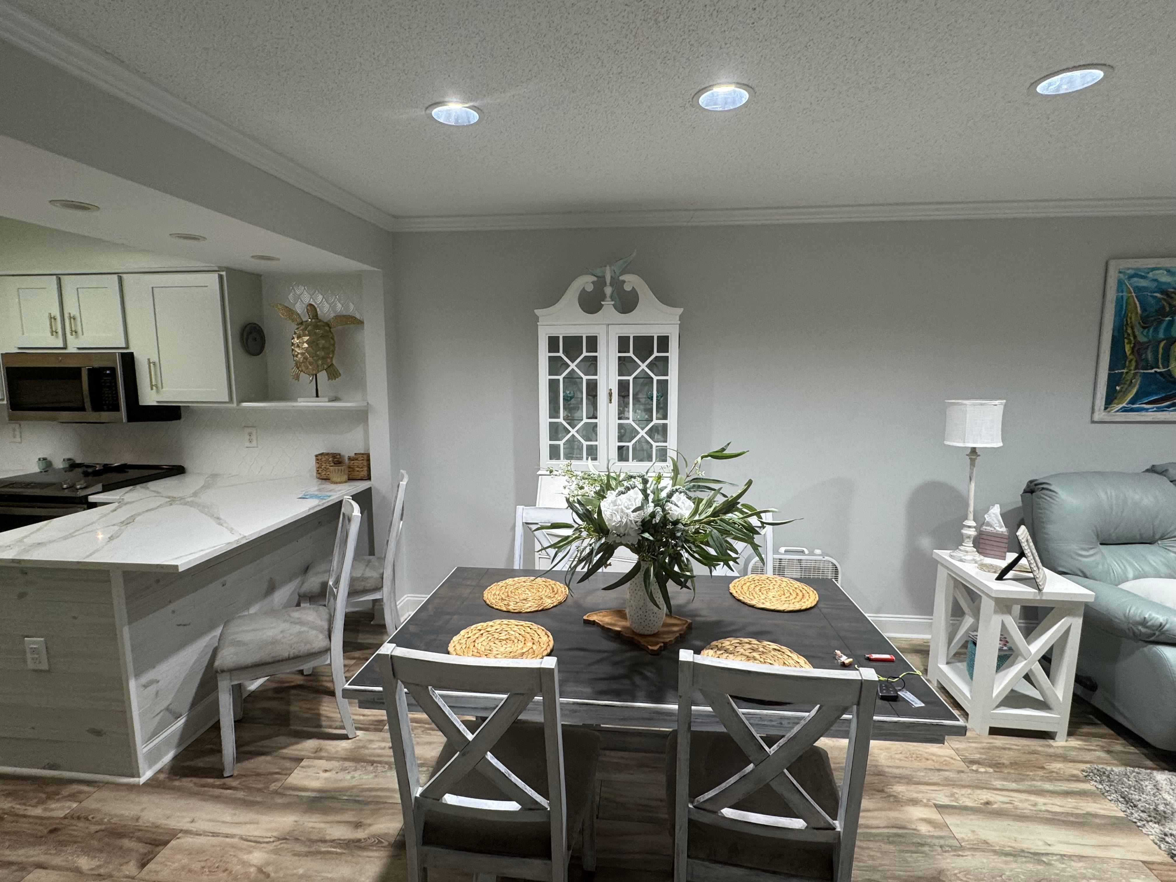 Kitchen, dining area and living room.