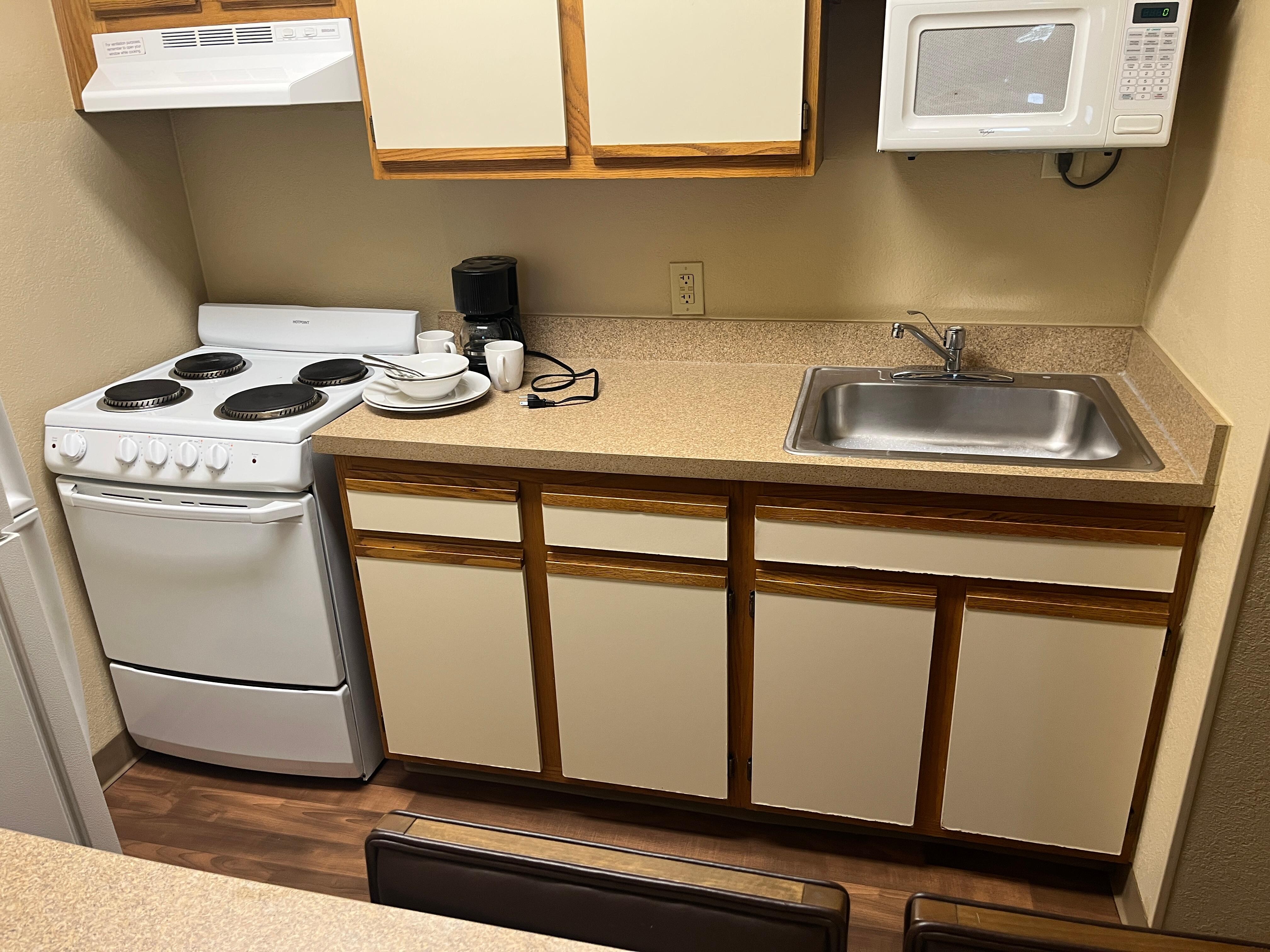 Kitchen with nothing in cupboards