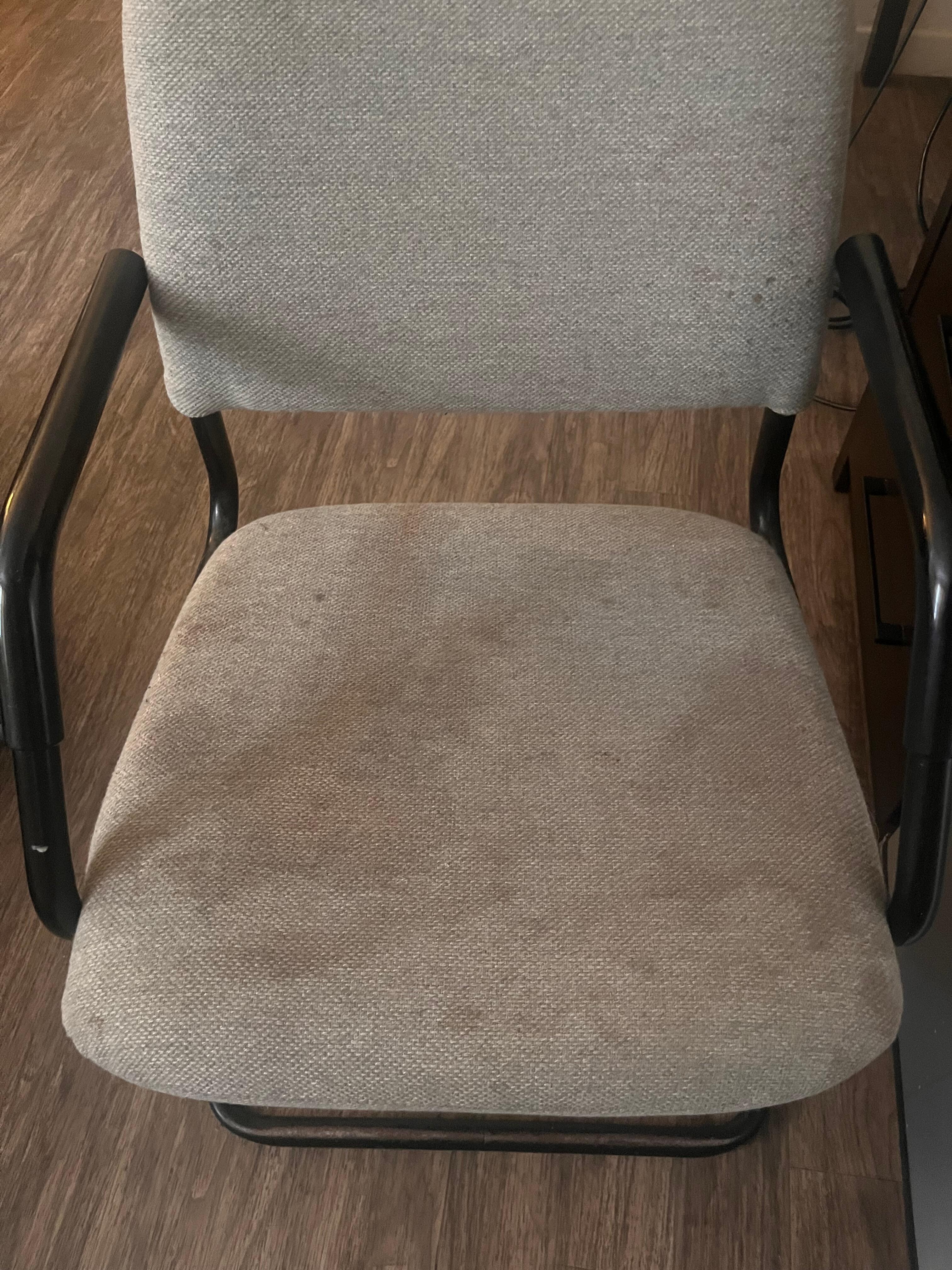 One of the chairs in the room to sit on