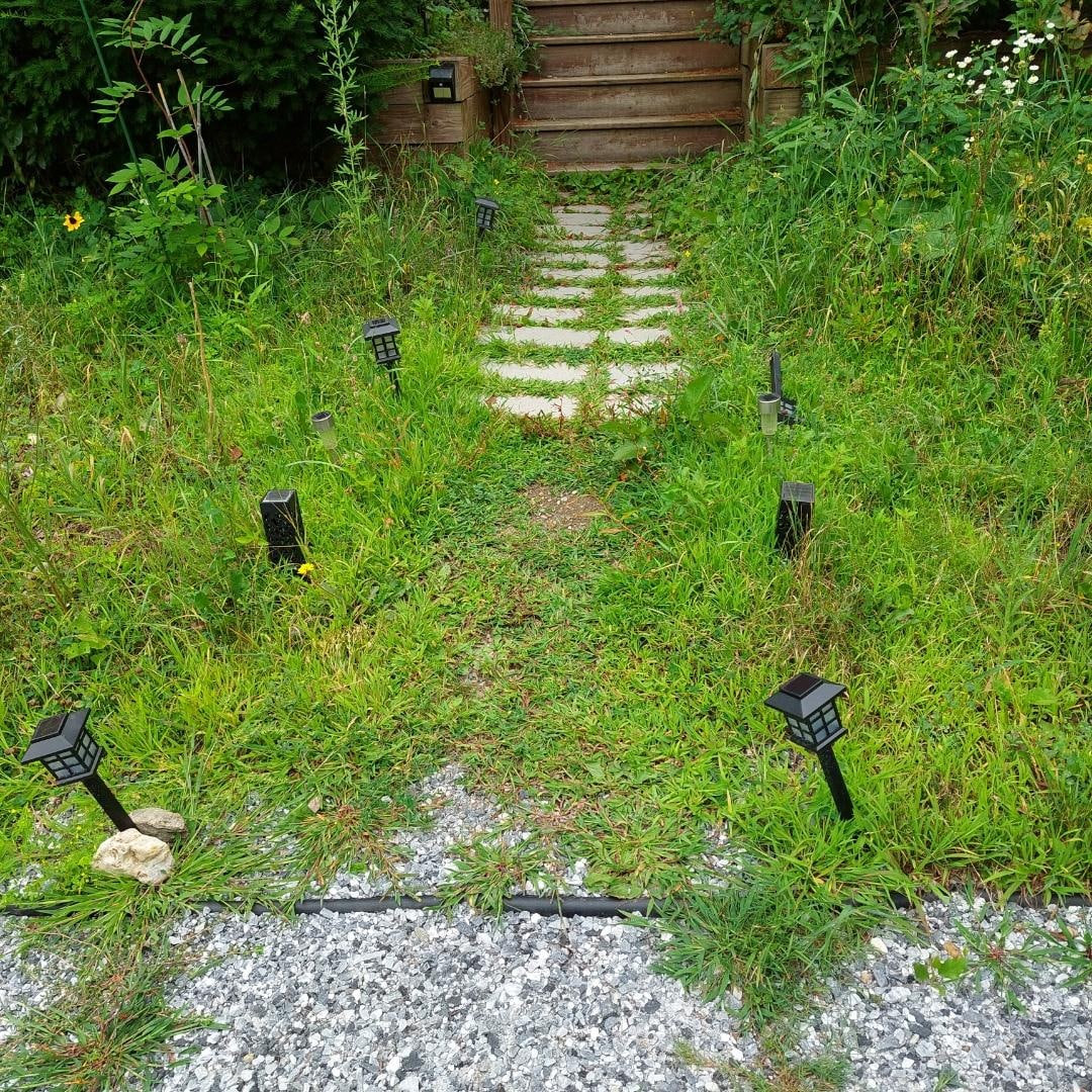 Lower walkway with dim or broken solar lighting