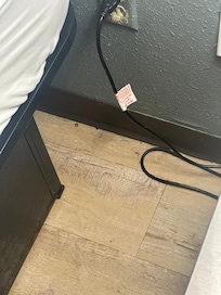 Floor unswept and outlet falling out of the wall