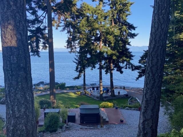 View from the cottage deck looking down at hot tub and lower patio.