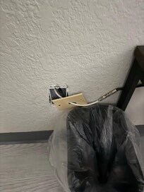 Wall outlet uncovered for cable