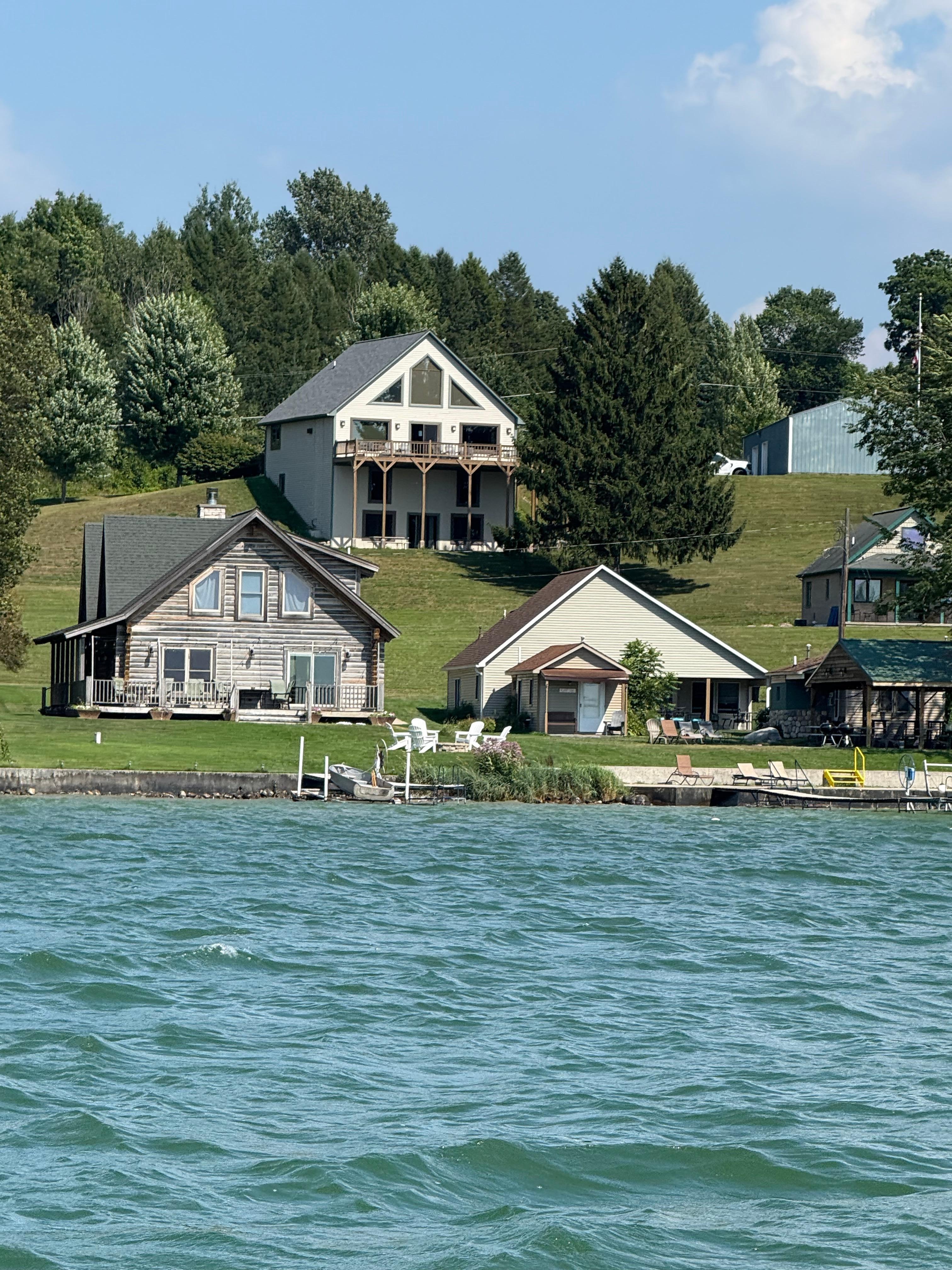 House at the top of the hill. View from boat. 