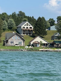 House at the top of the hill. View from boat.