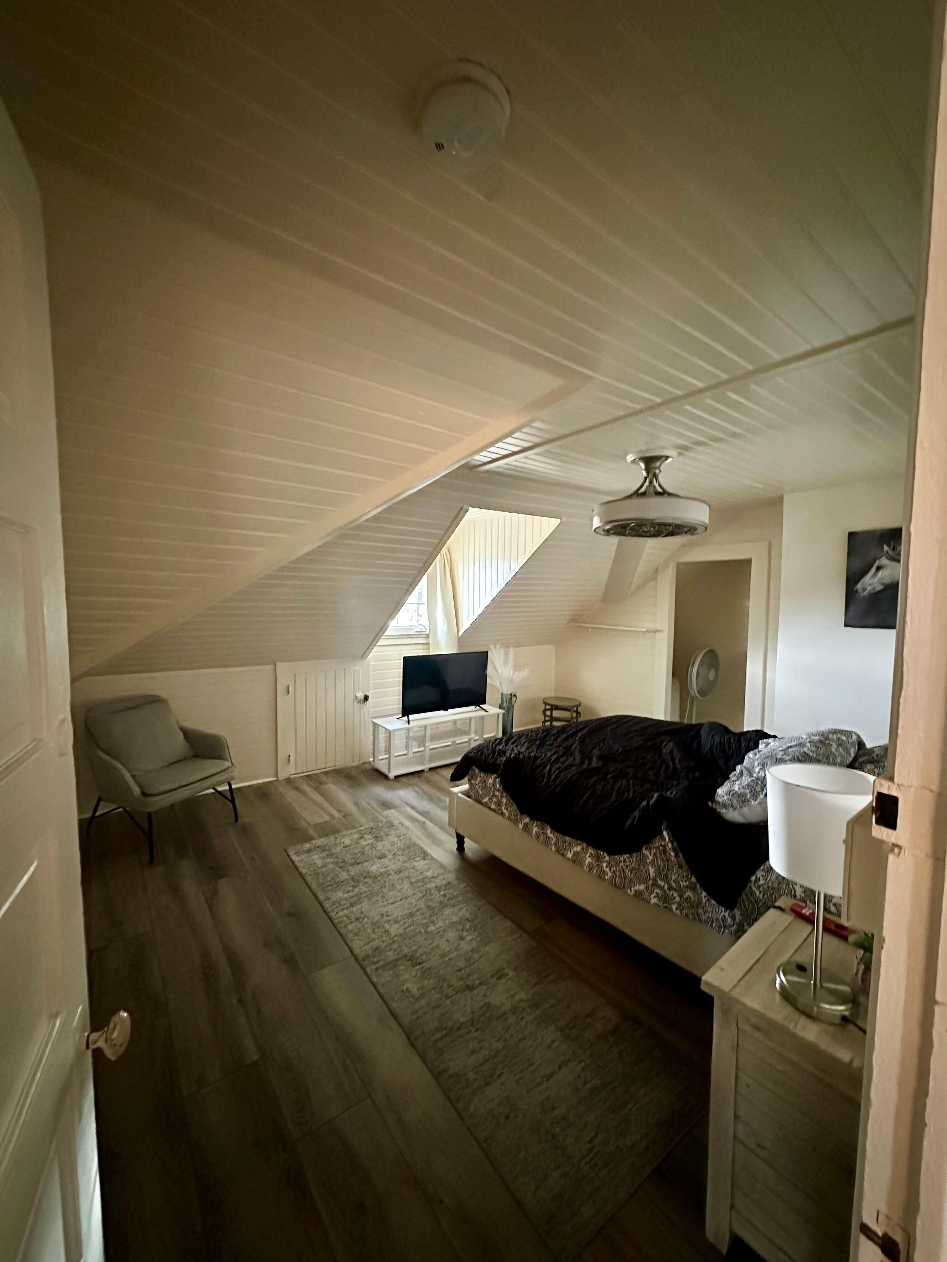 Larger bedroom with a queen bed… and very low vaulted ceilings (only about 5.5’!)