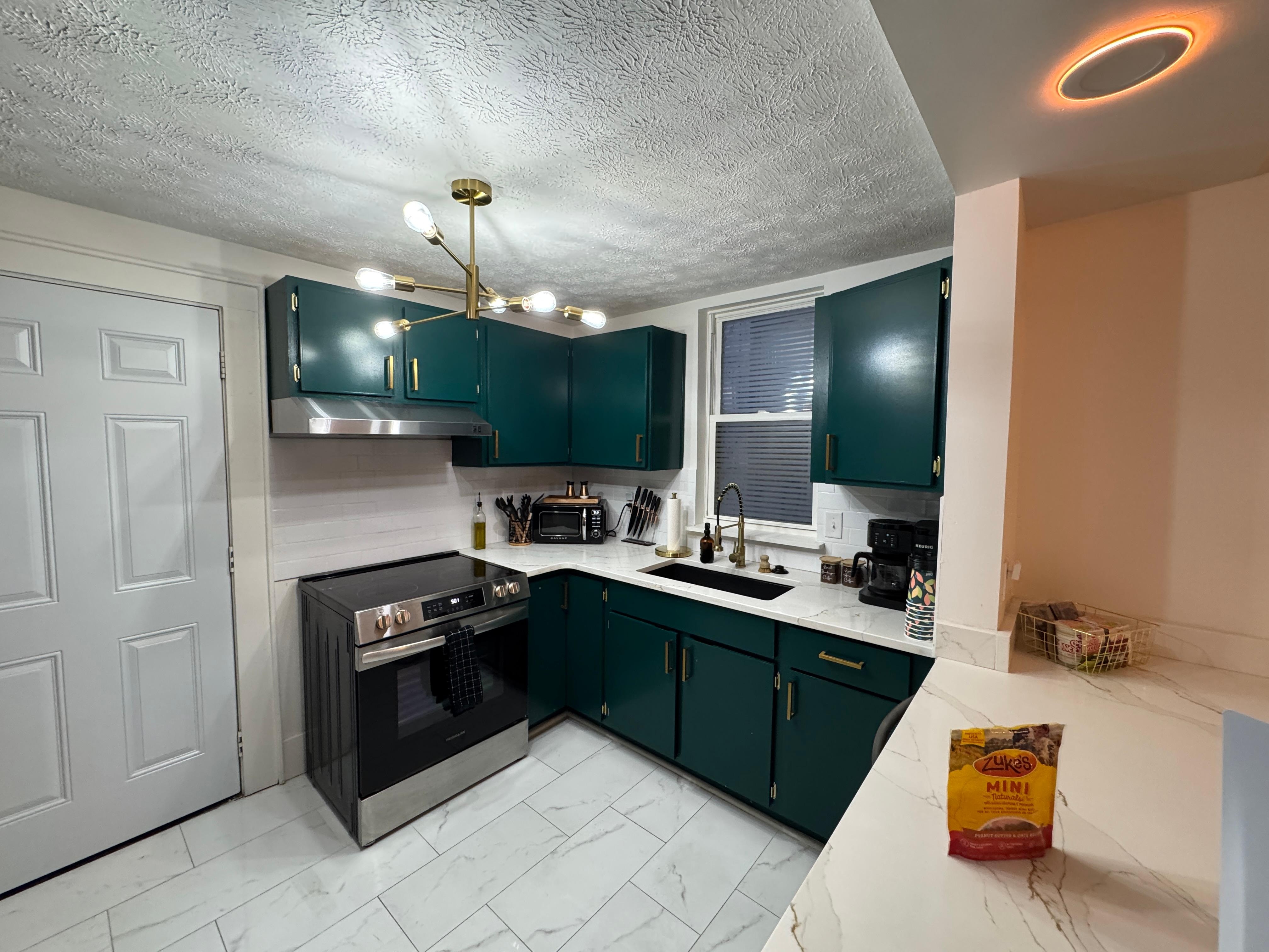 Kitchen. Excuse the doggy treats. This is a pet-friendly establishment, and we had our baby with us. 🐕‍🦺😊