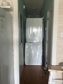 Washer and dryer blocking hallway due to water leak