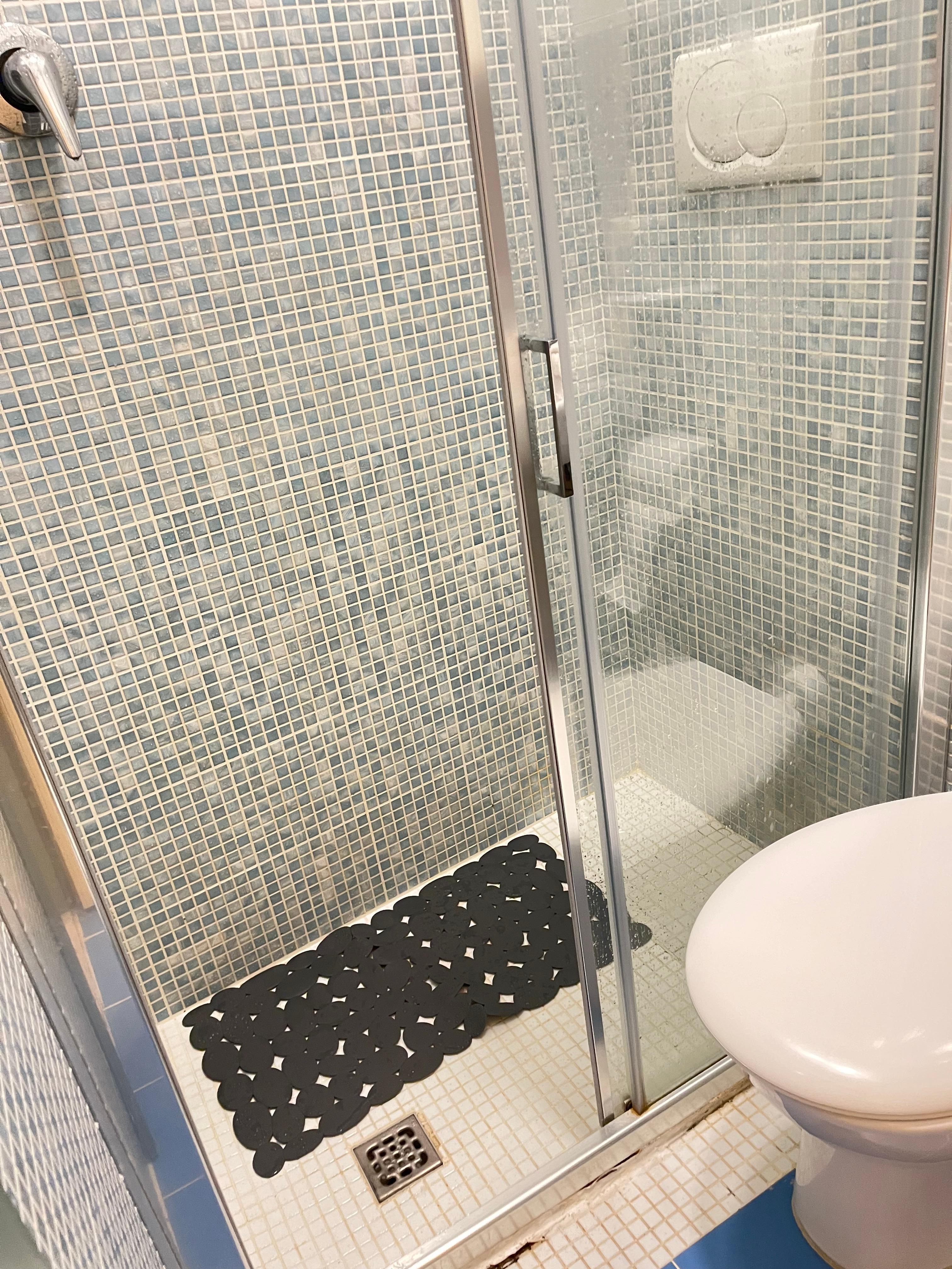 That bath\room, see the flush is inside the shower. And that drain stinks the whole room.