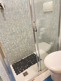 That bath\room, see the flush is inside the shower. And that drain stinks the whole room.