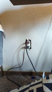 Plug in living room that shocked the maintenance guy.