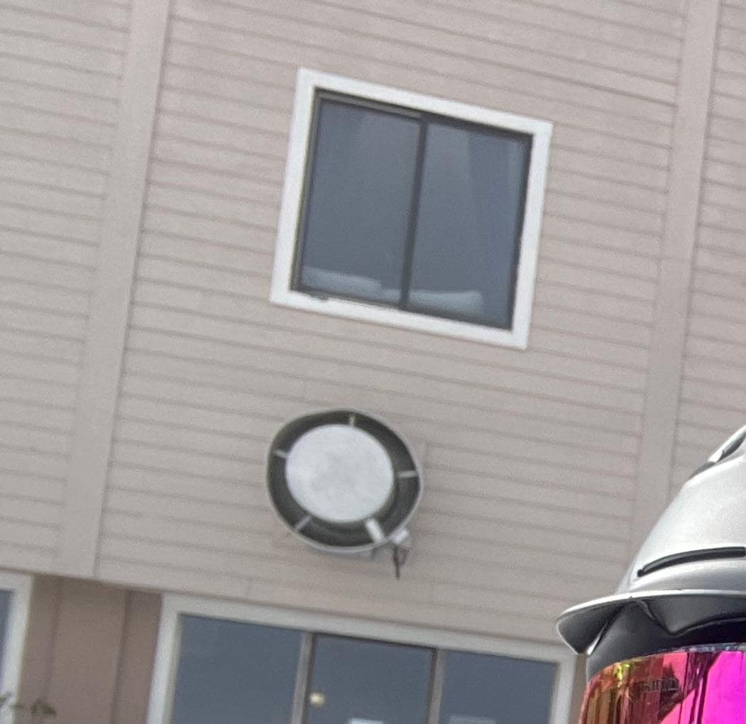 The window is where the condo is at and the huge fan from the restaurant kitchen is right below the window. 