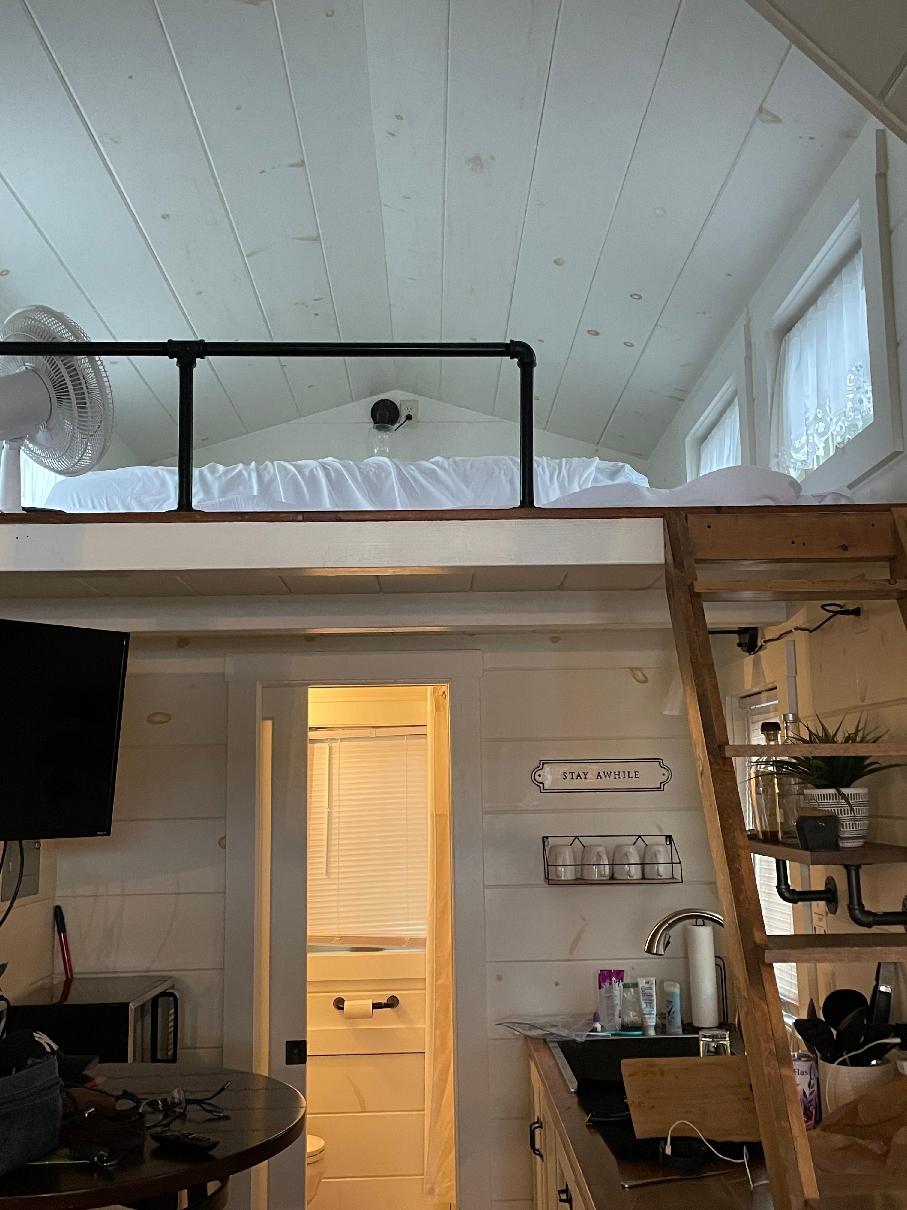 Ladder up to loft with Queen bed. 