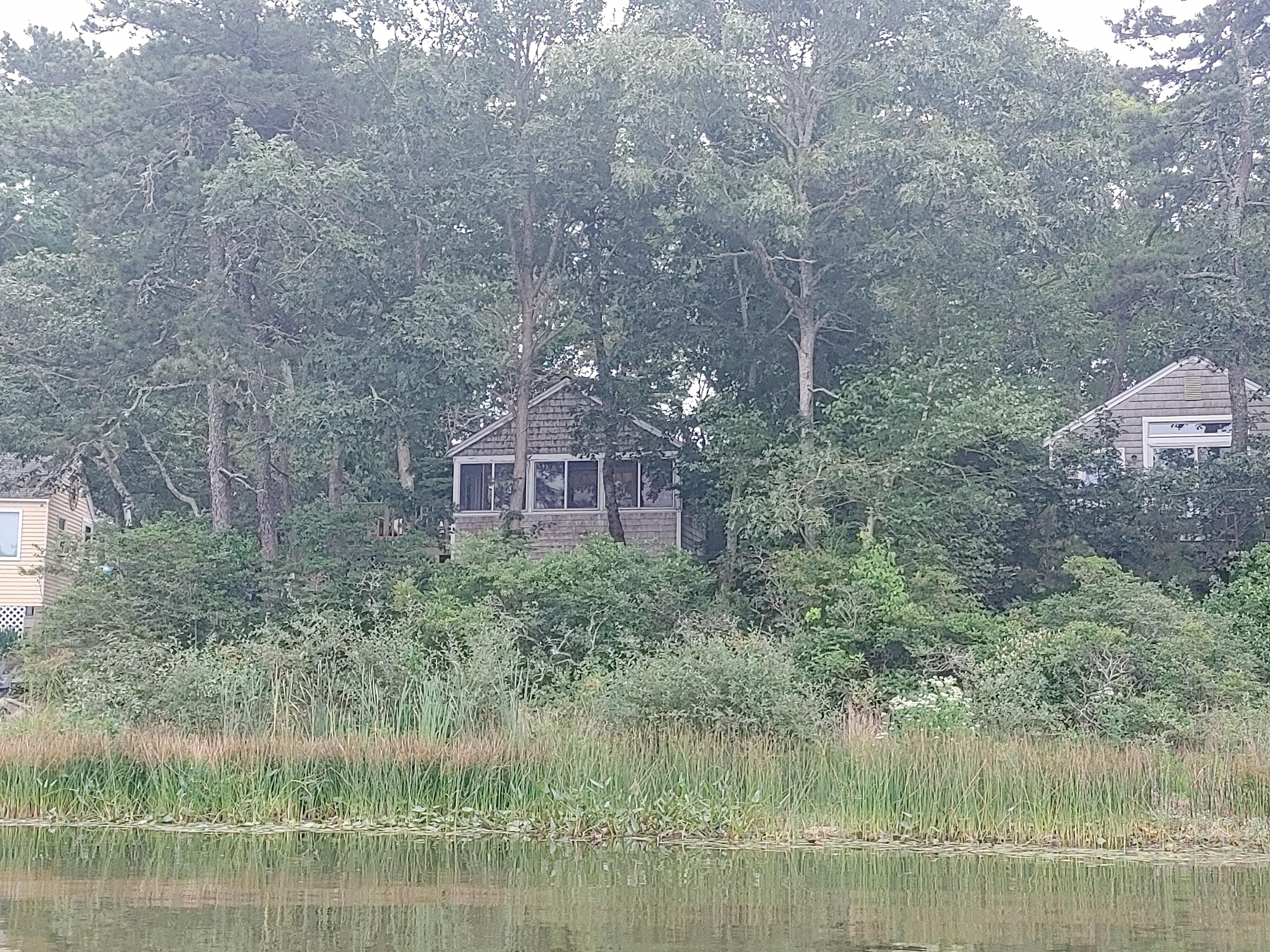 Cottage from row boat in pond