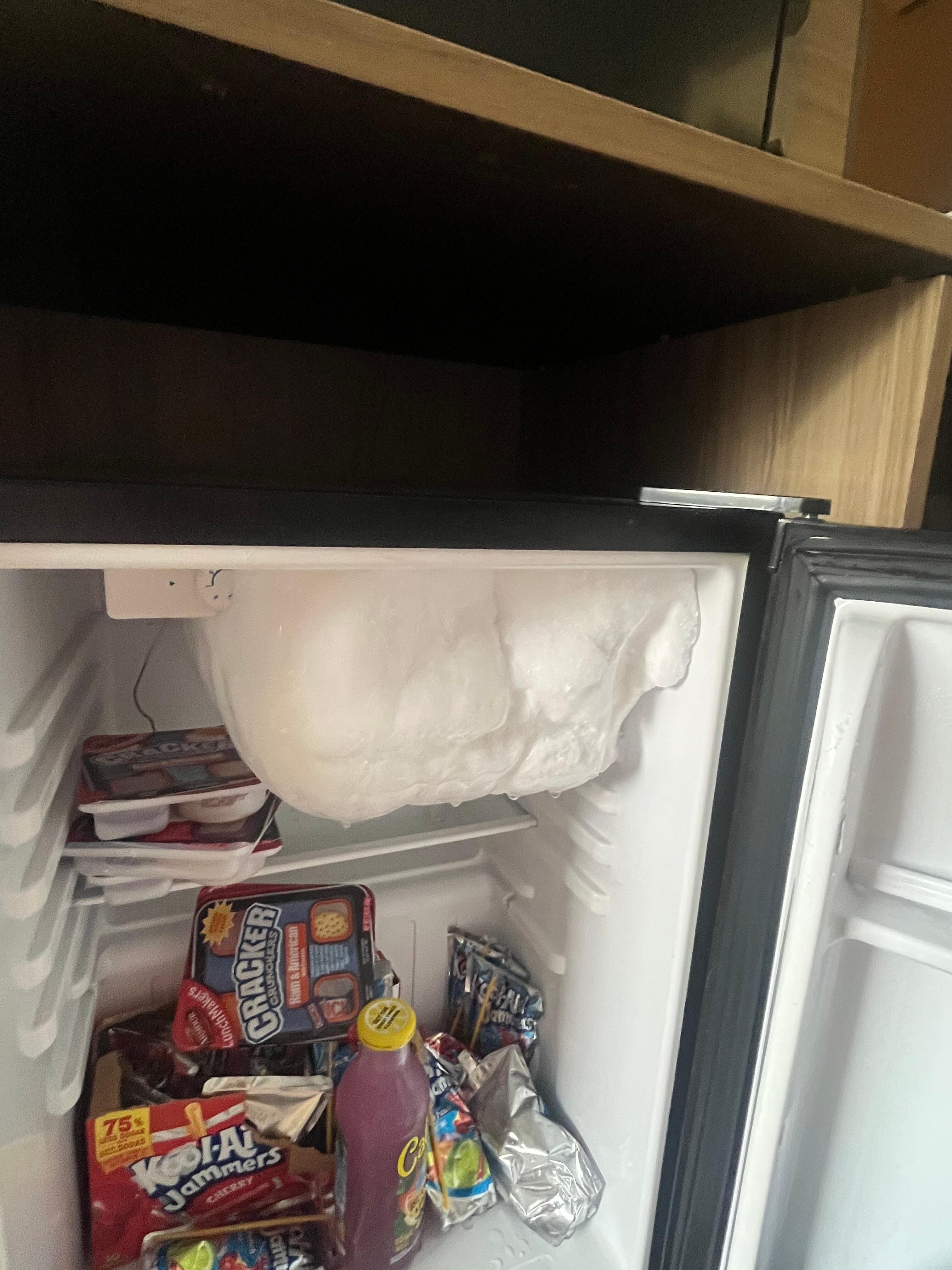 Built up ice in mini fridge 