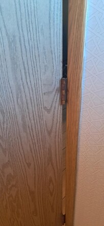 Rusted hinges on bathroom door